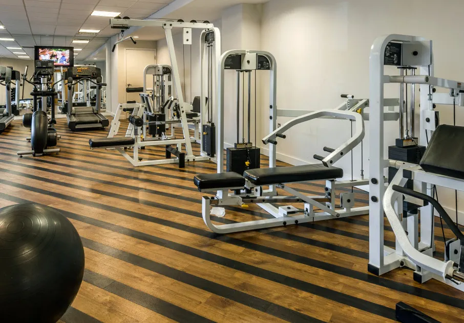 The fitness center at our apartments for rent in Washington DC, featuring assorted exercise machines.