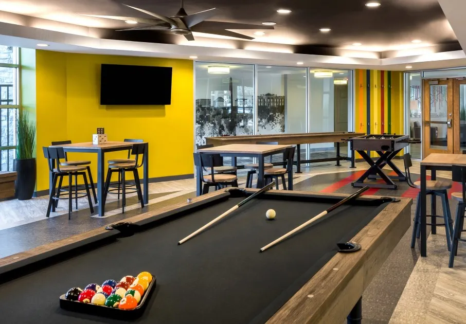 The resident lounge at our apartments for rent in Washington DC, featuring ample seating and a billiards table.