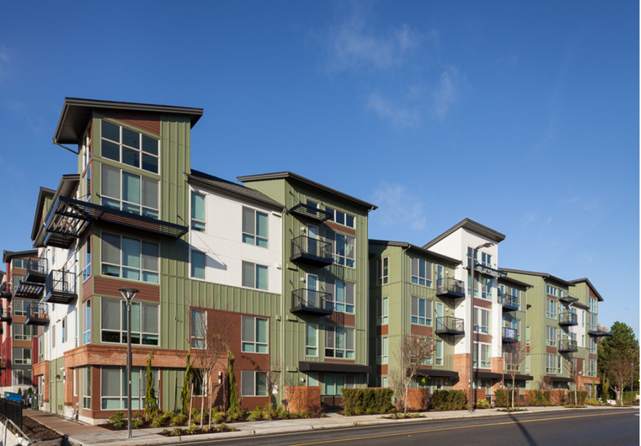 The exterior of our apartments for rent in Kenmore, WA featuring a modern facade and a view of the balconies.