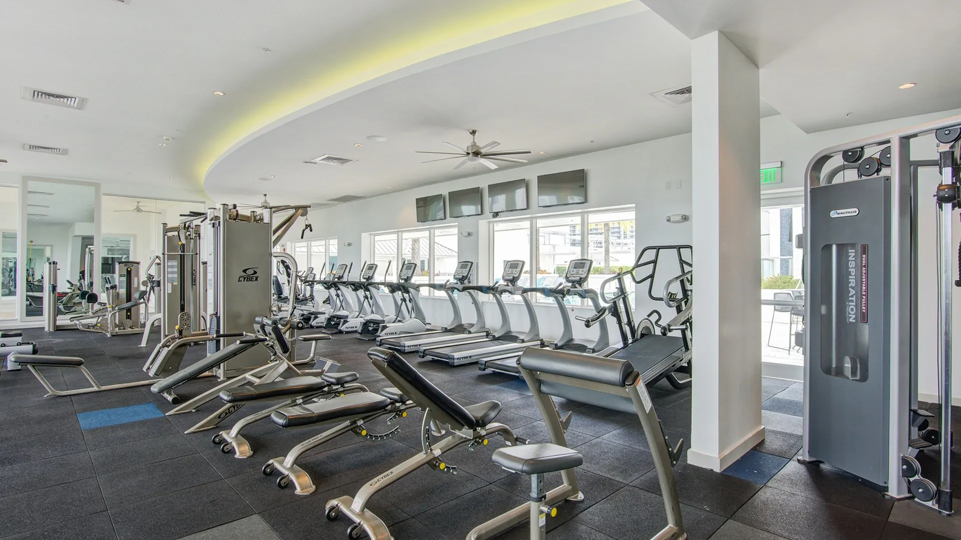 Fitness center at our Brickell, Miami apartments for rent featuring exercise machines and cardio equipment.
