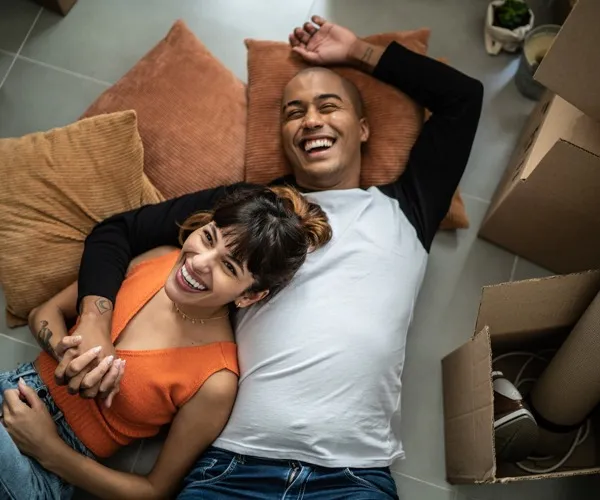 Couple laying in floor