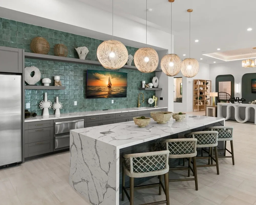 Resident lounge and kitchen at Marlowe Ridgewood apartments for rent in Davenport, FL, featuring counter seating.