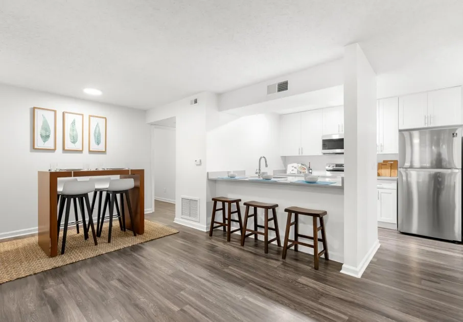 Model kitchen at our apartments for rent in Clearwater, FL, featuring stainless steel appliances and counter seating.