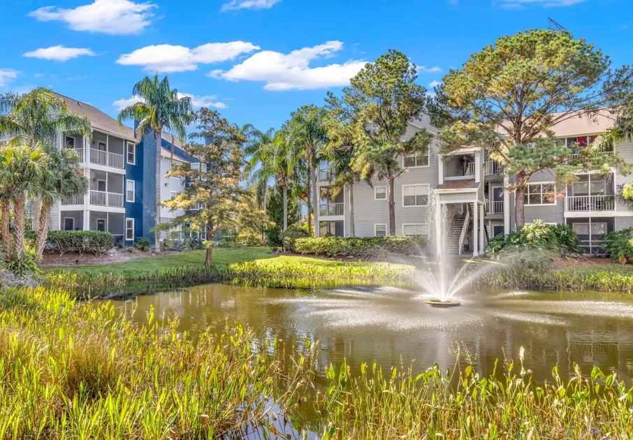 The water feature at our apartments for rent in Clearwater, FL, featuring a fountain and view of the apartments.