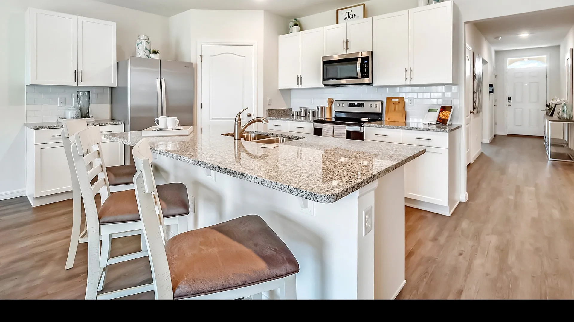 kitchen with white cabinets and island