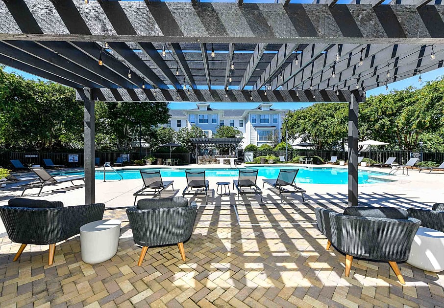Lounge seating with pergola by pool