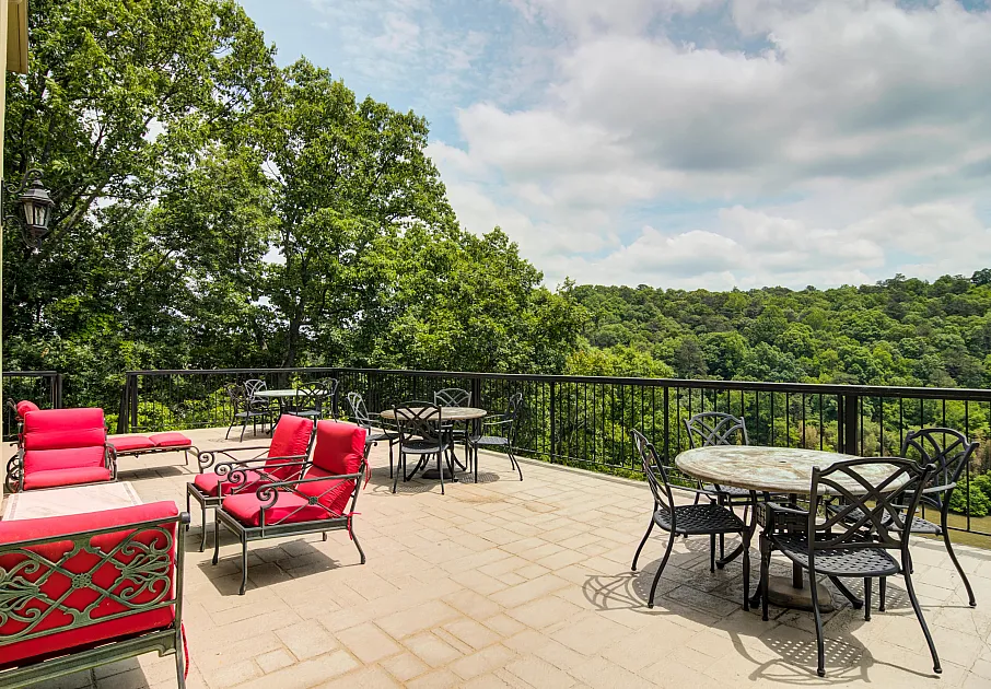 Outdoor patio seating overlooking foliage