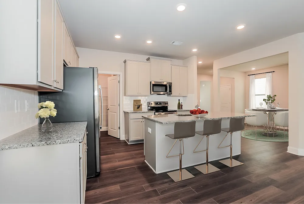 kitchen with white cabinets and island