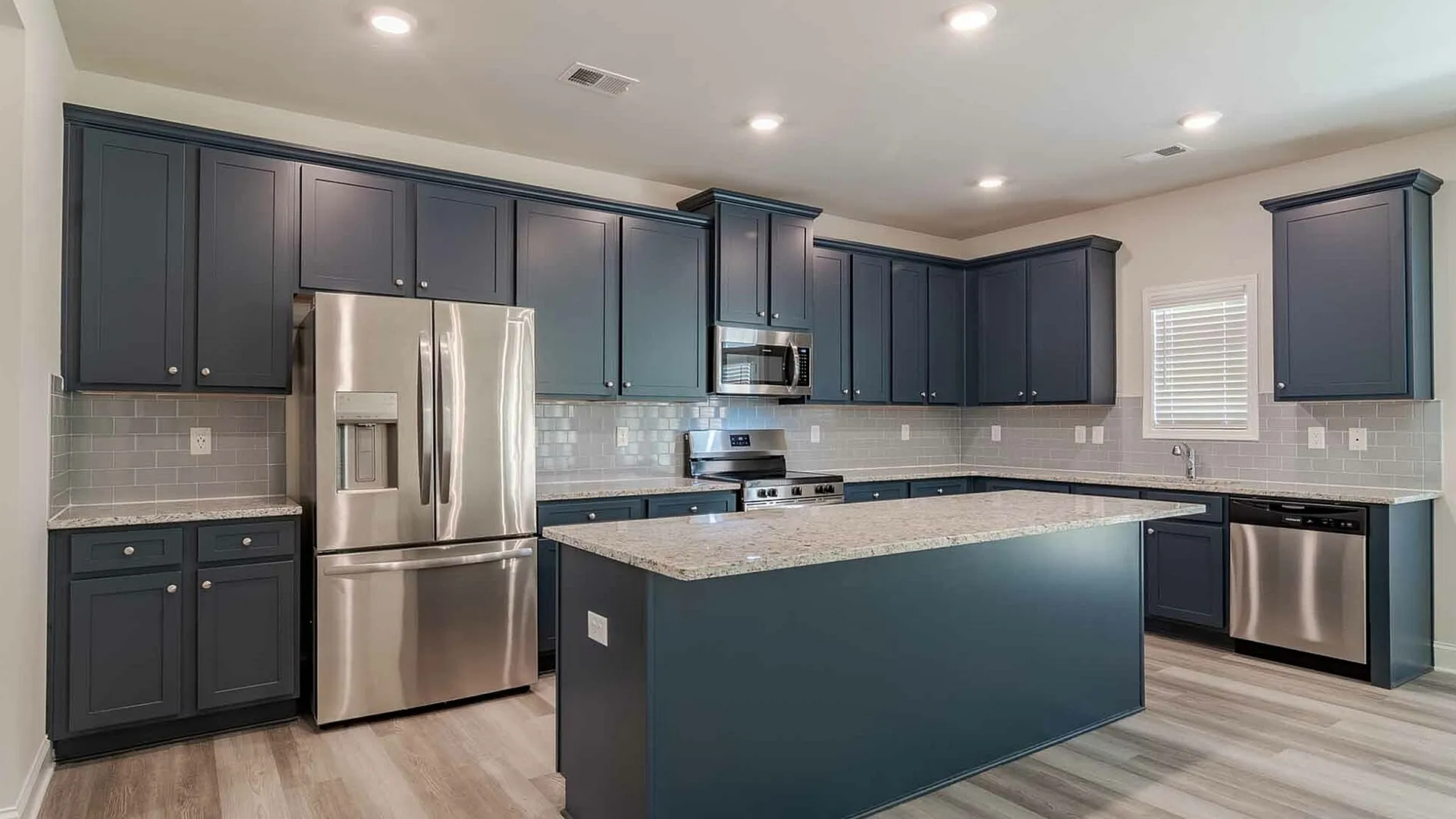 kitchen with navy cabinets