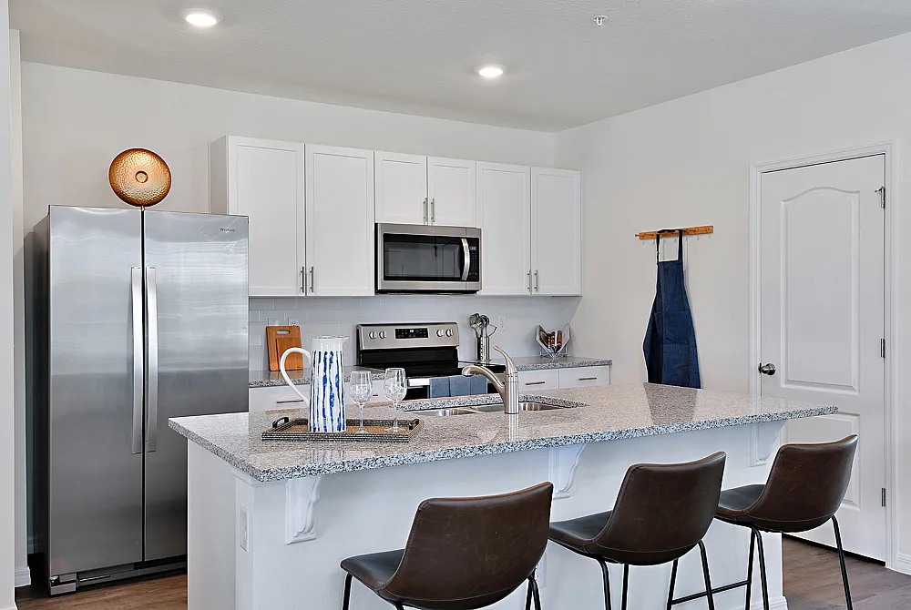 kitchen with white cabinets and island