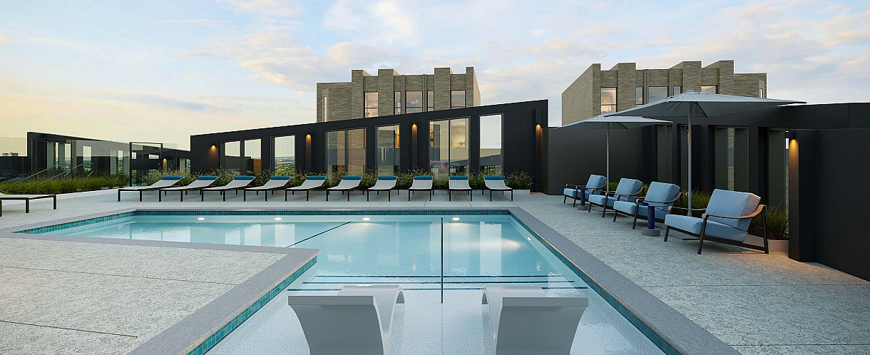 Luxurious rooftop pool area with stylish lounge chairs, elegant umbrellas, and modern architecture under a clear sky.