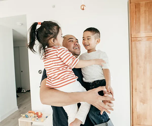 Bright and welcoming family-friendly apartment featuring modern wooden cabinetry and a cozy atmosphere, perfect for creating joyful memories.