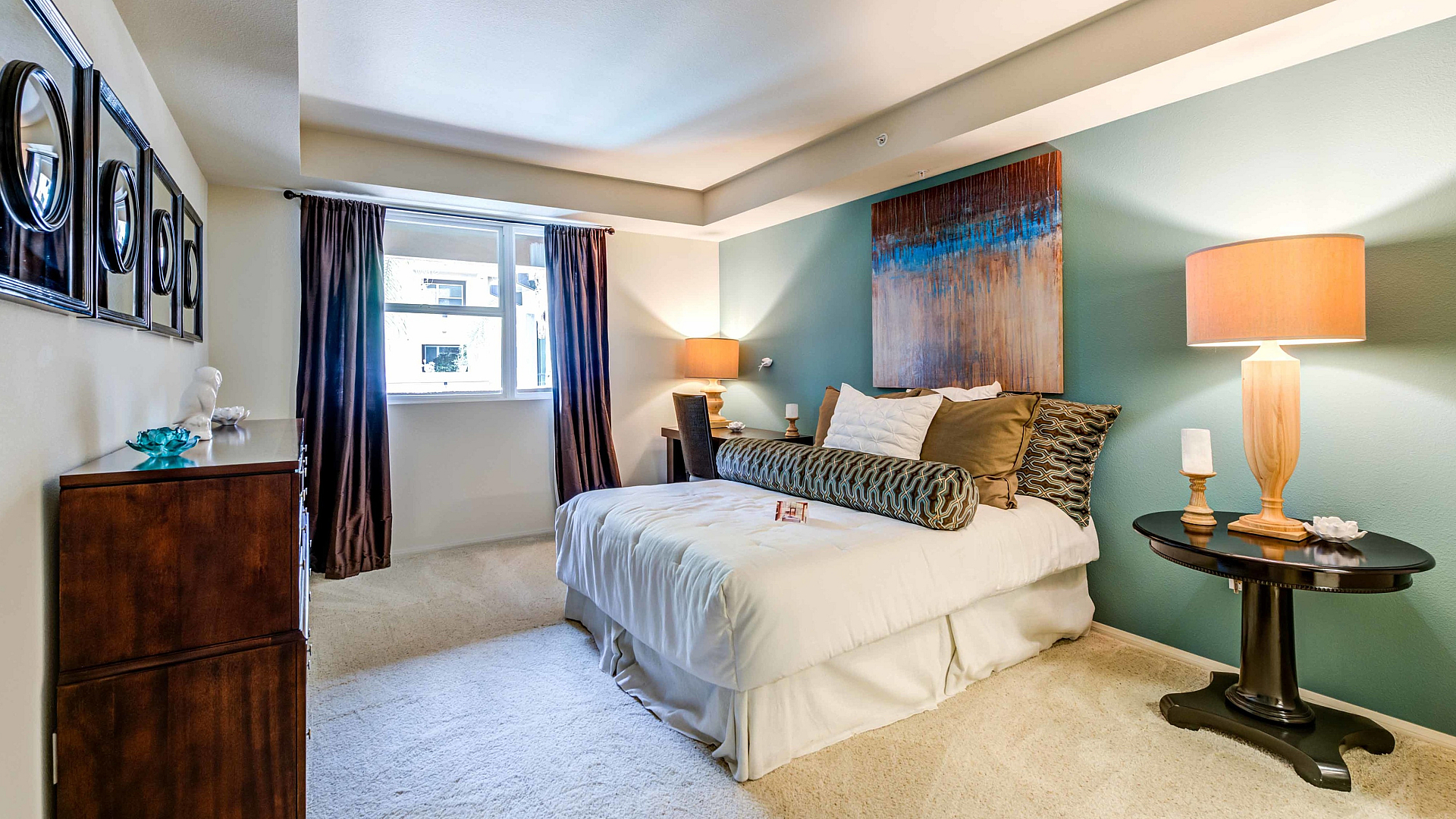 Luxurious bedroom with elegant decor, plush bedding, and ambient lighting creating a cozy retreat.