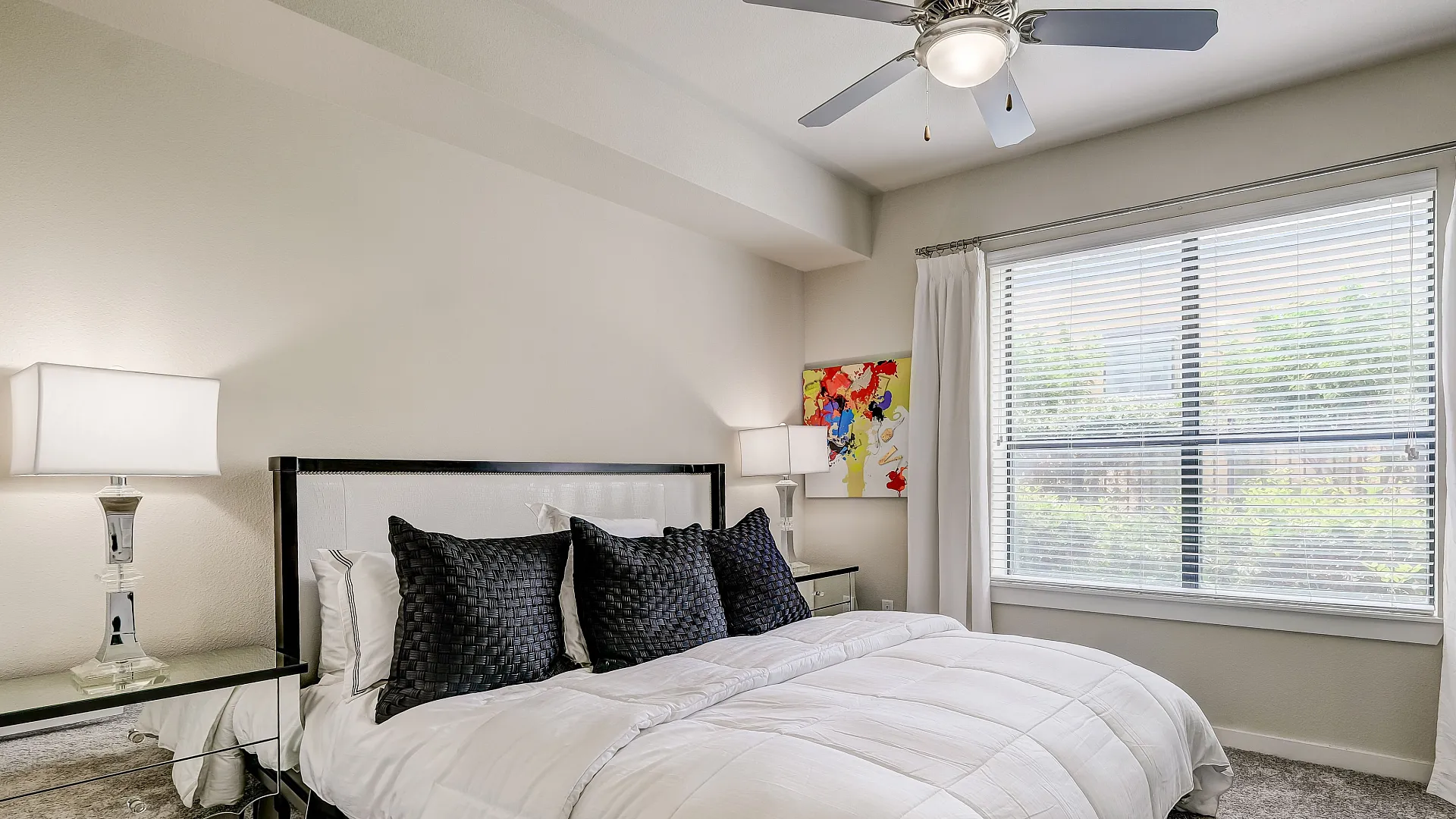 Chic living bedroom room featuring modern decor with a cozy bed