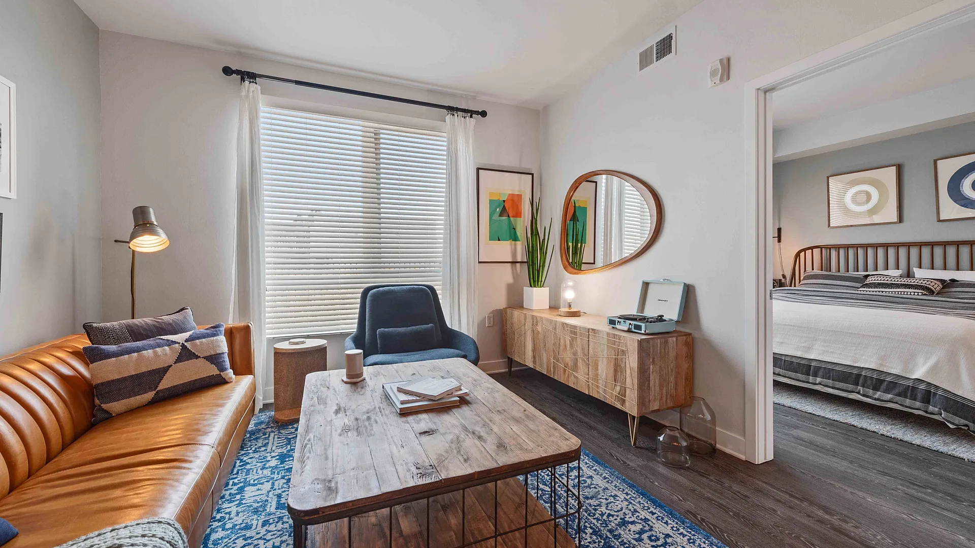 Chic and inviting lobby space featuring exposed brick walls, contemporary art, and vintage bicycles for a warm urban vibe.