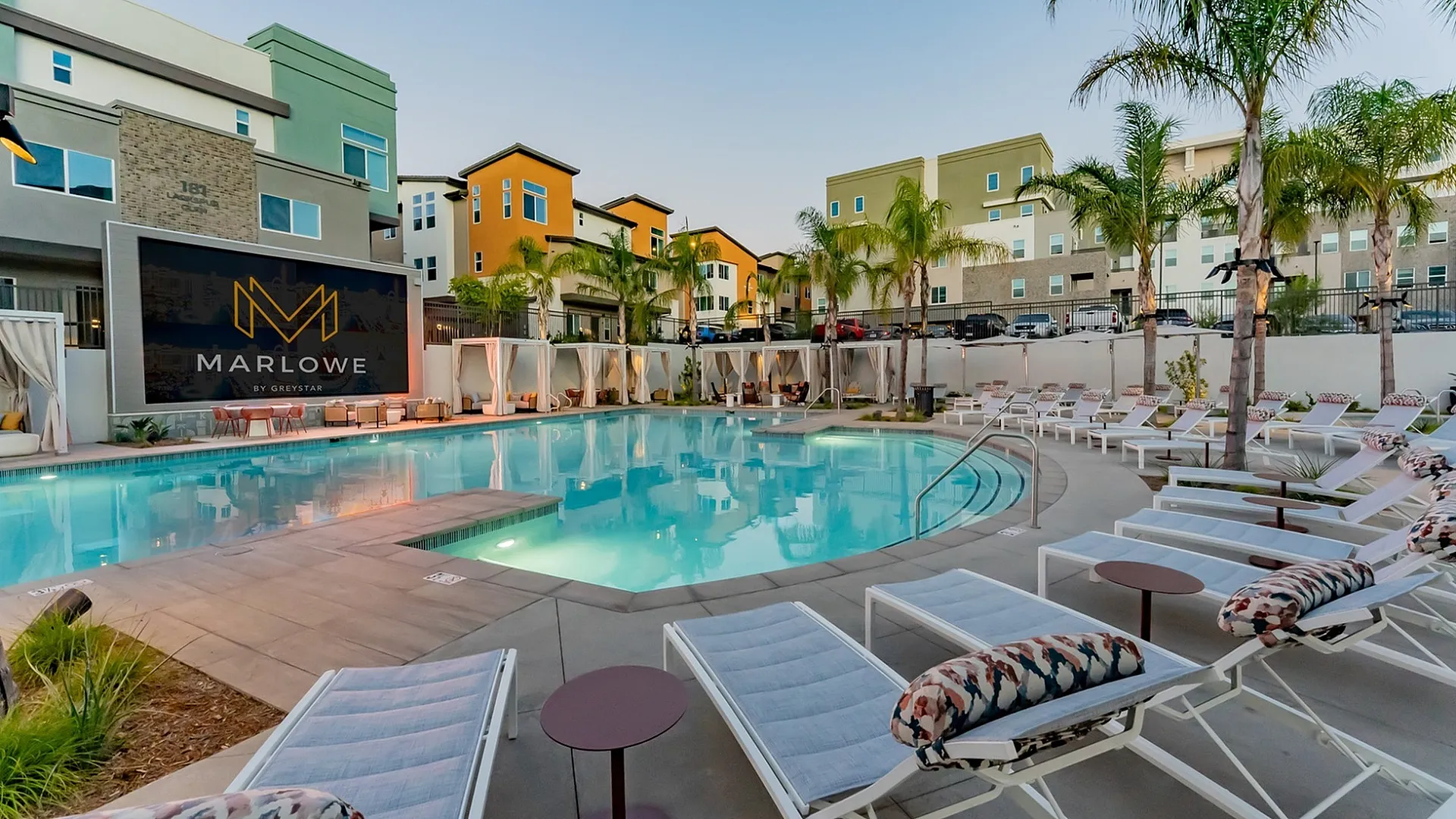 Resort-style swimming pool with lounge seating at Marlowe Palomar Heights Escondido apartments for rent.
