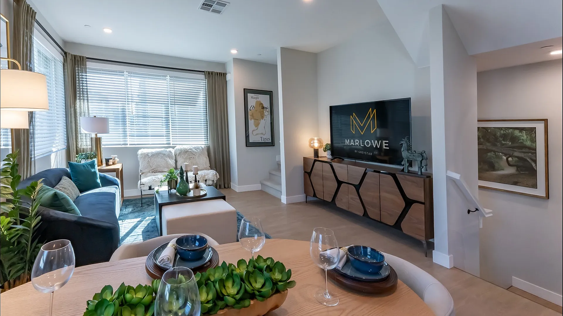 Spacious living room with large windows and abundant natural light at Marlowe Palomar Heights apartments in San Diego, CA.