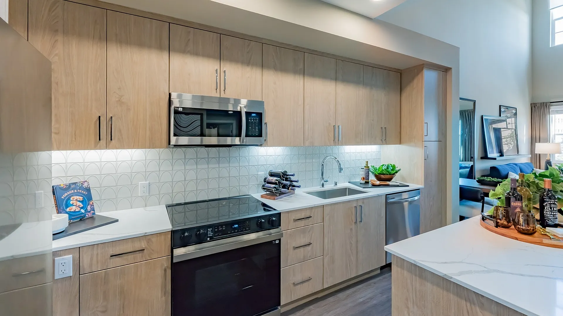 Modern kitchen featuring stainless steel appliances and contemporary cabinetry  at Marlowe Palomar Heights apartments in Escondido.