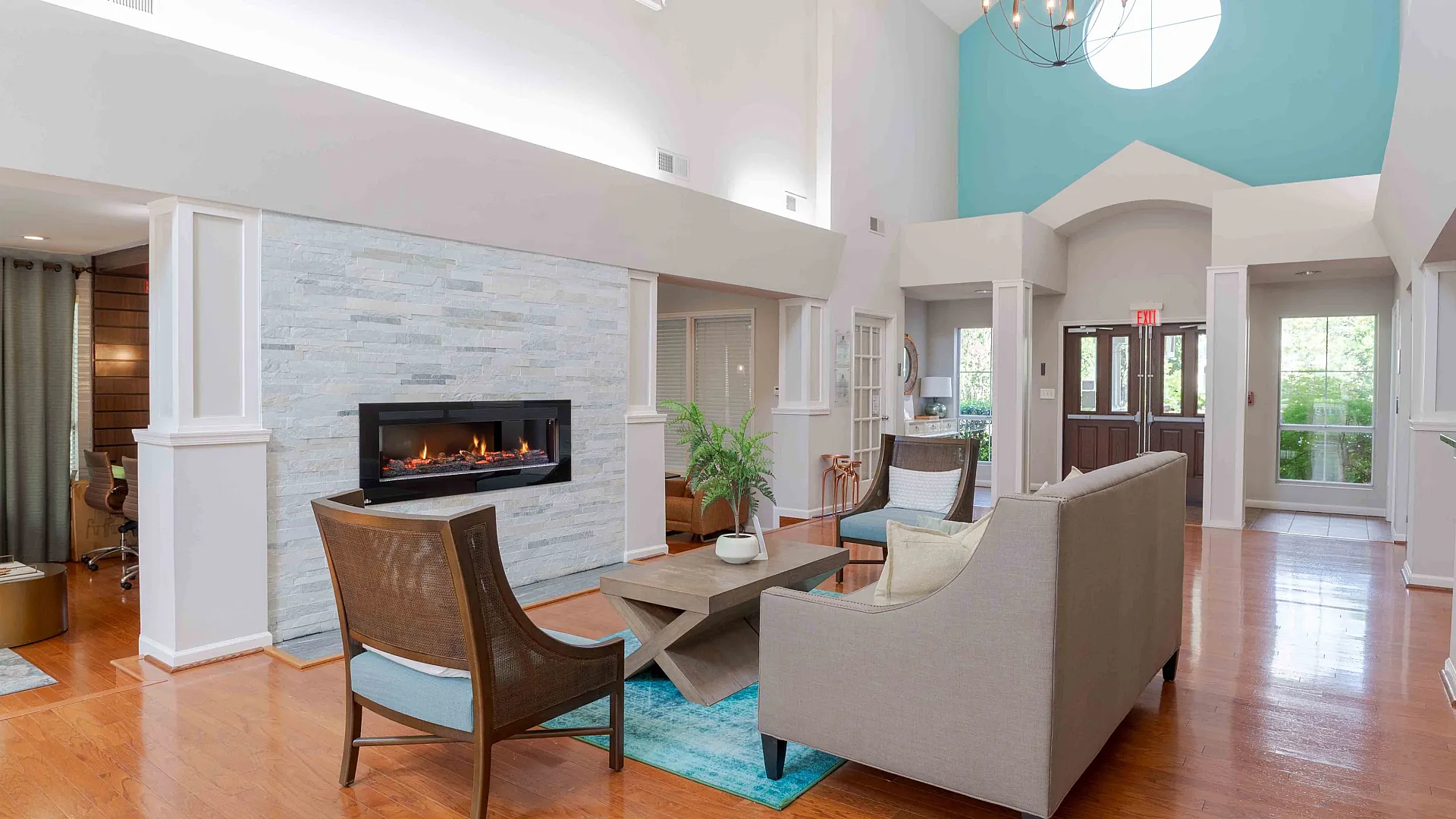 Bright and inviting clubhouse with fireplace and lounge seating