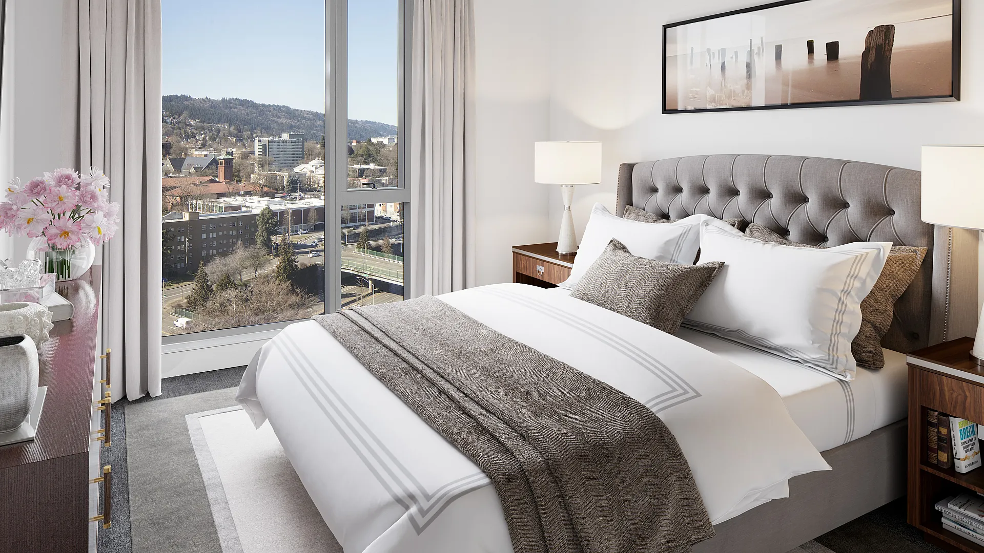 Bright and elegant bedroom with a luxurious bed, modern decor, and a stunning city view through large windows.