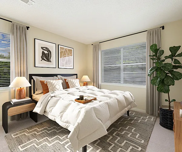 Inviting bedroom with elegant decor, featuring a cozy bed, stylish artwork, abundant natural light, and a lush green plant.