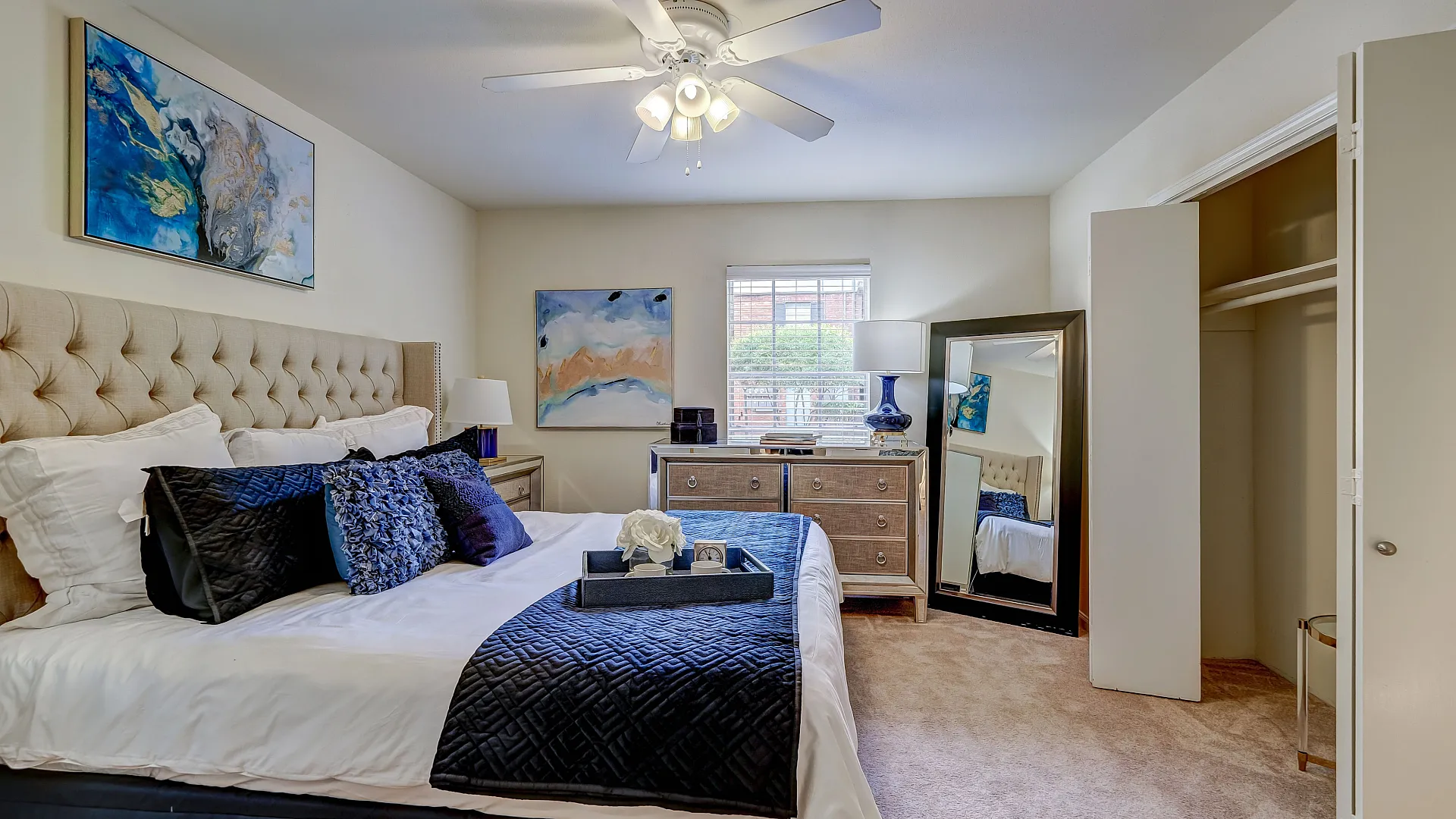 Charming bedroom with elegant decor, featuring a plush bed, stylish artwork, and a cozy atmosphere perfect for relaxation.