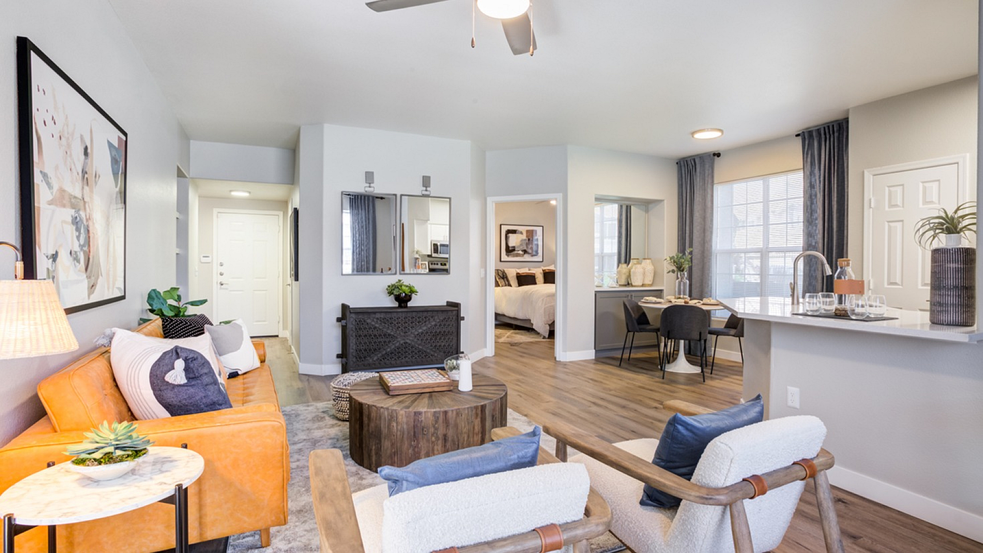 Modern open-plan living space featuring a cozy living room with stylish decor, a contemporary kitchen, and a beautiful dining area. Perfect for comfortable and luxurious living.