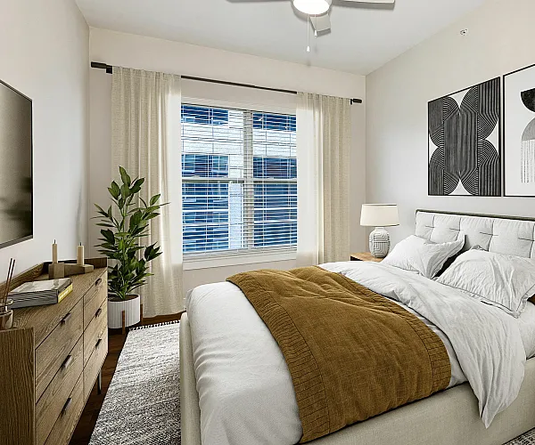 Elegant bedroom with modern decor, featuring a plush bed, stylish artwork, and large window for natural light.