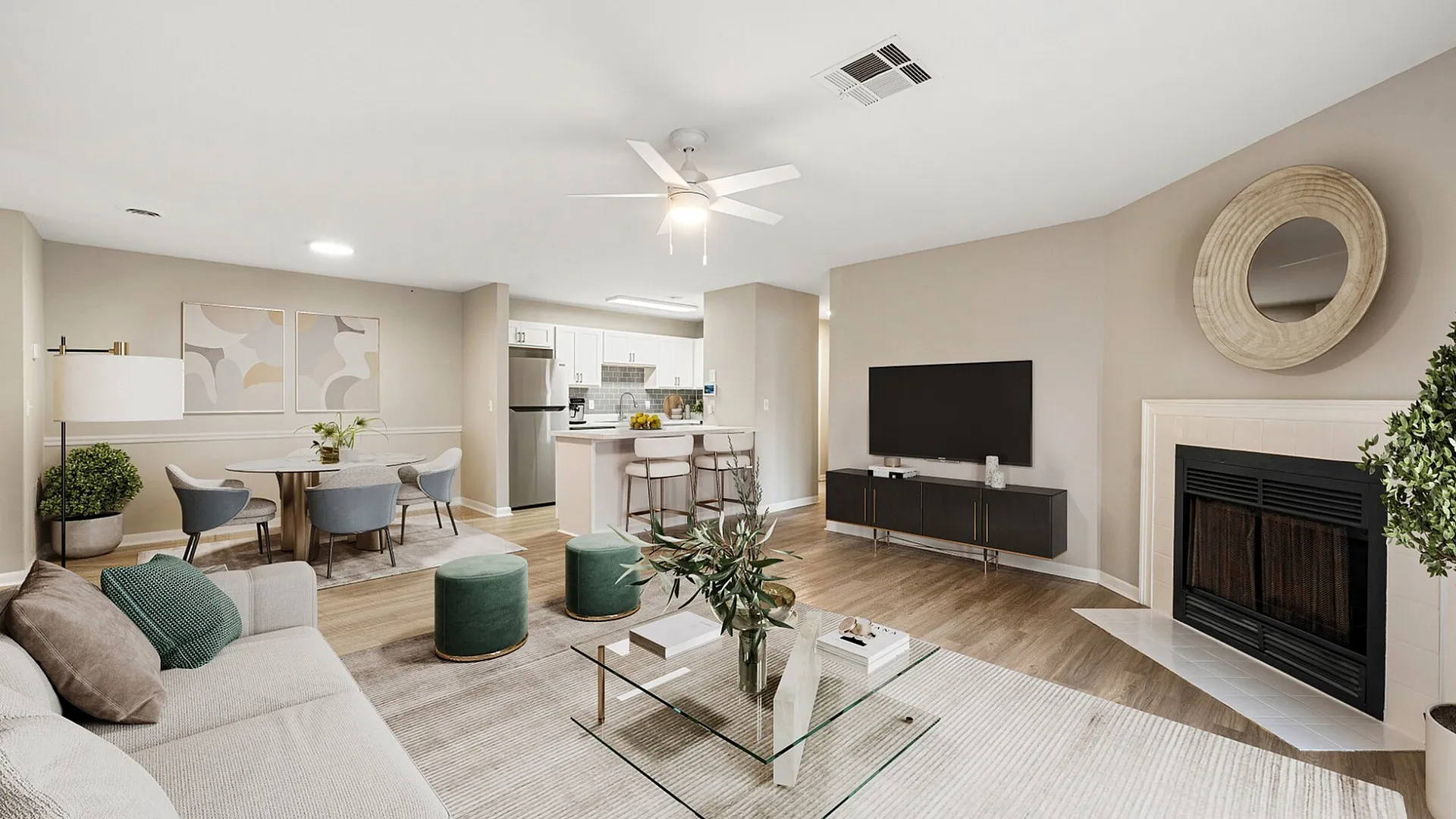 Modern open-concept living space featuring a cozy sitting area, stylish dining table, sleek kitchen, and chic decor in a well-lit apartment.