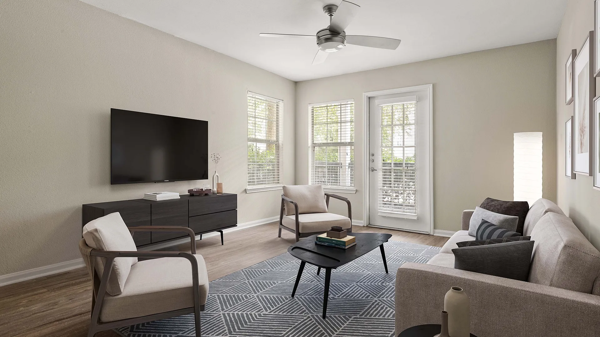 Bright and elegant living room featuring modern furniture, a sleek TV setup, and large windows offering plenty of natural light.