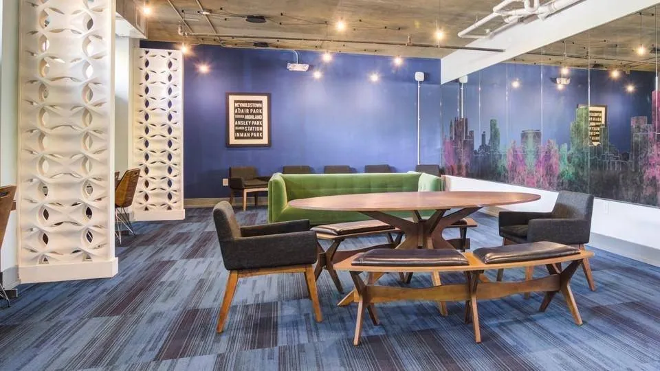 Study lounge with collaborative seating and vibrant wall art