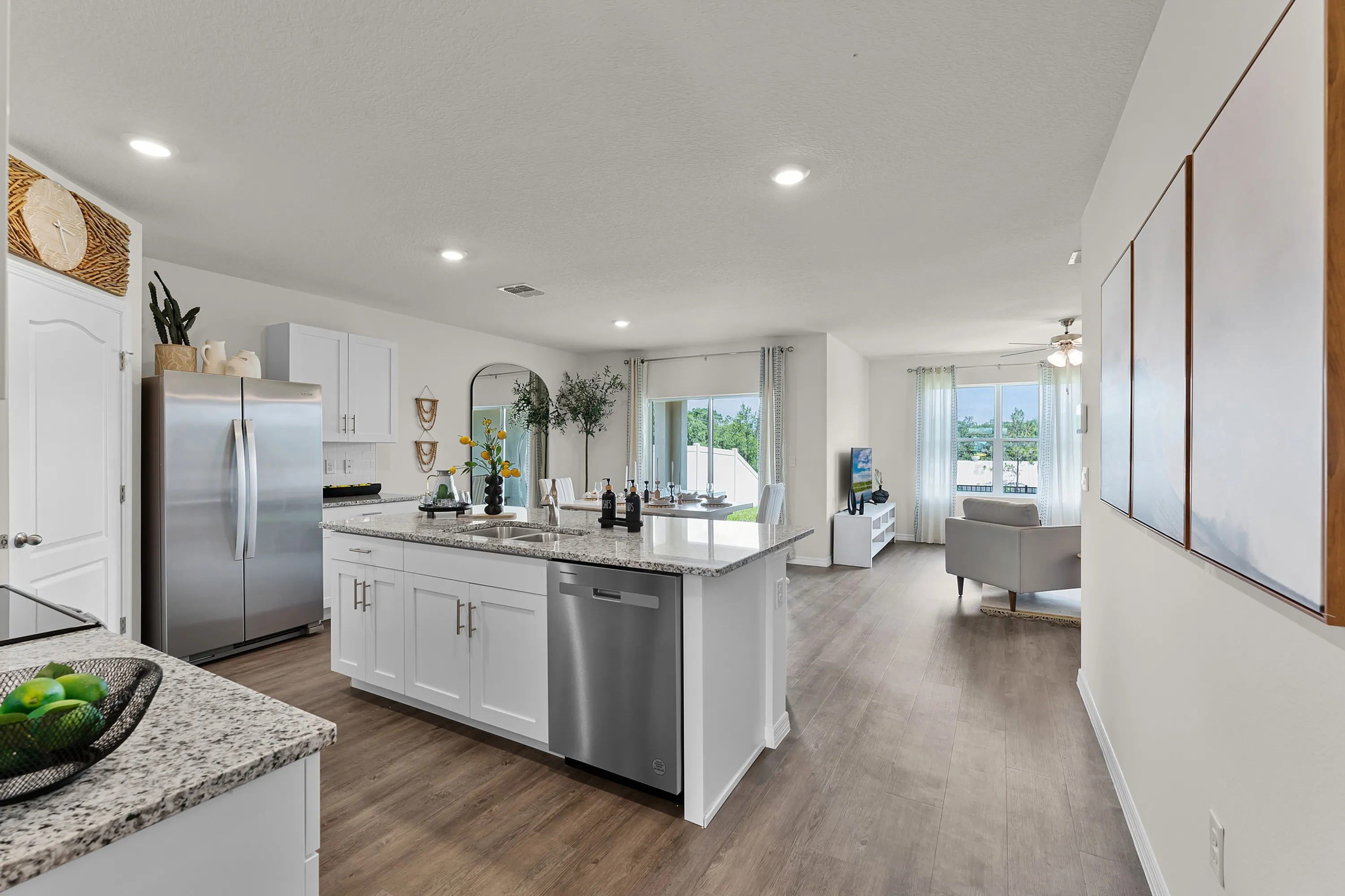 Spacious open-concept layout with modern kitchen and living area.