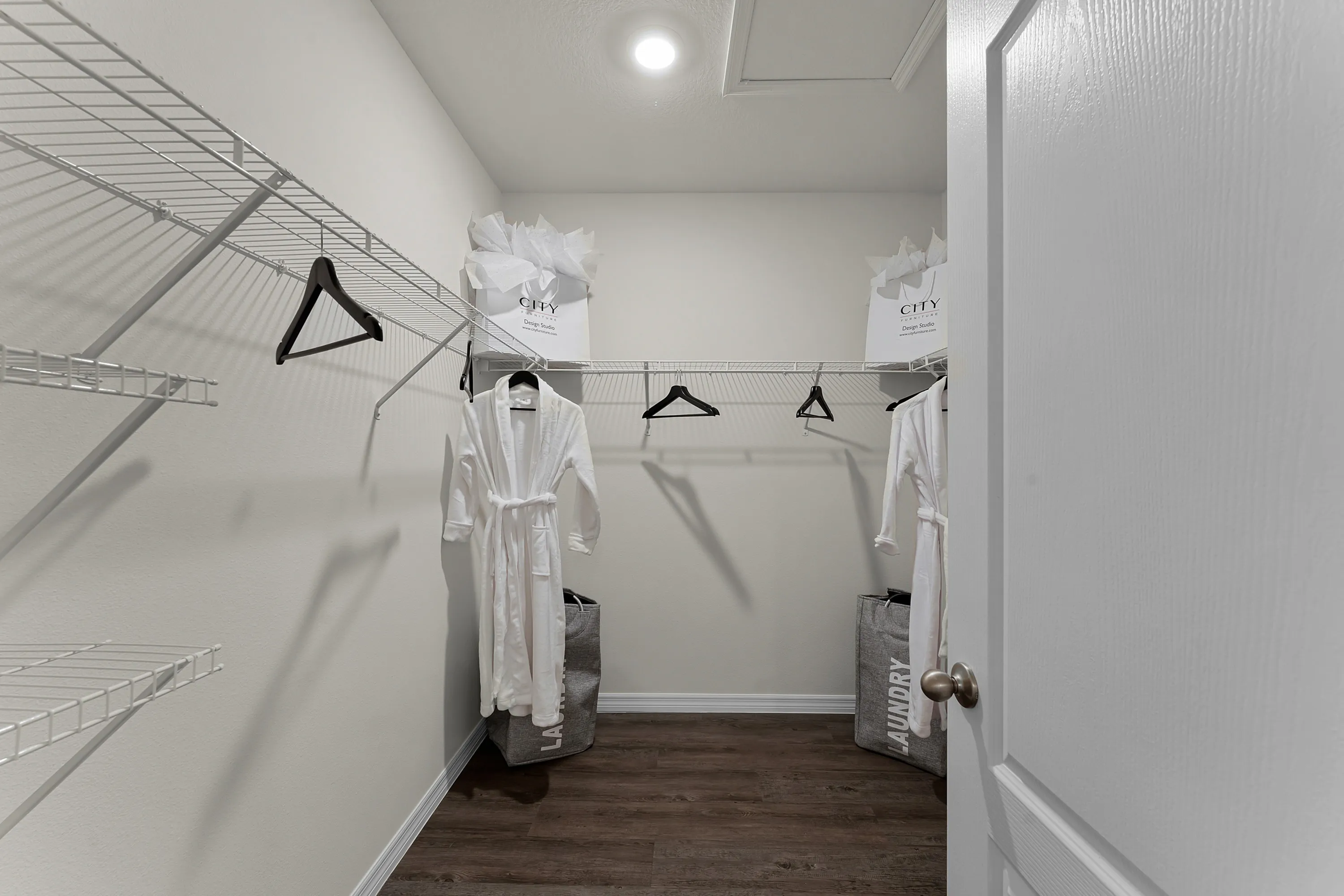Walk-in closet with ample shelving and storage space.