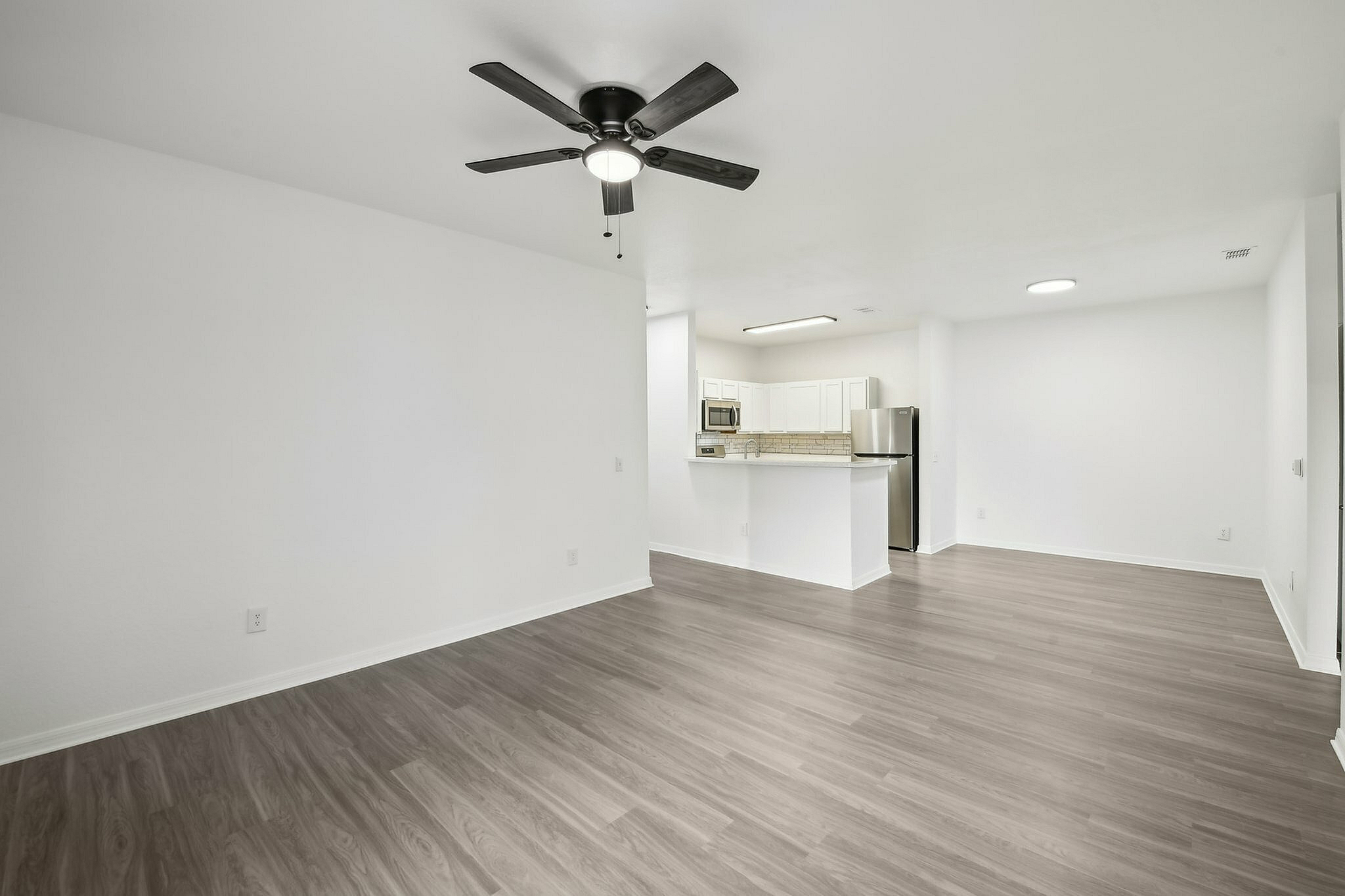 interior pic of deluxe unit with gray planking and white walls