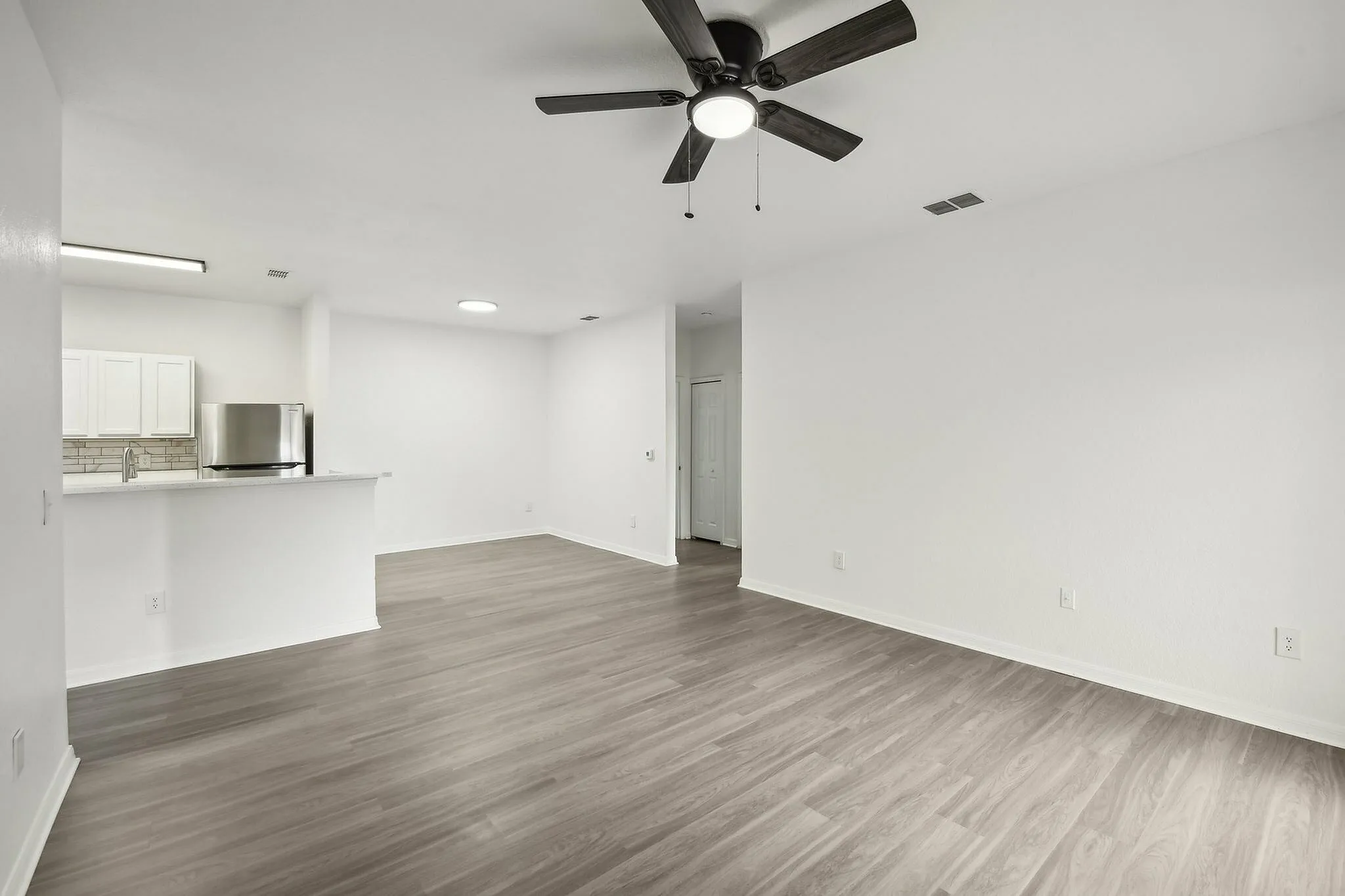 interior pic of deluxe unit with gray planking and white walls