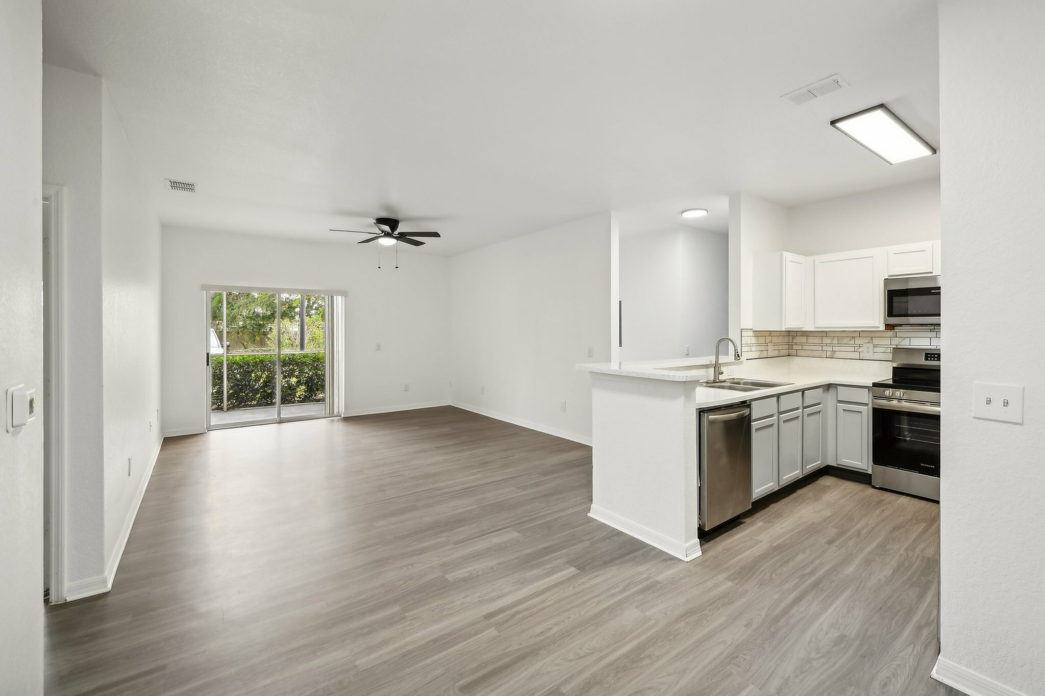 interior pic of deluxe unit with gray planking and white walls