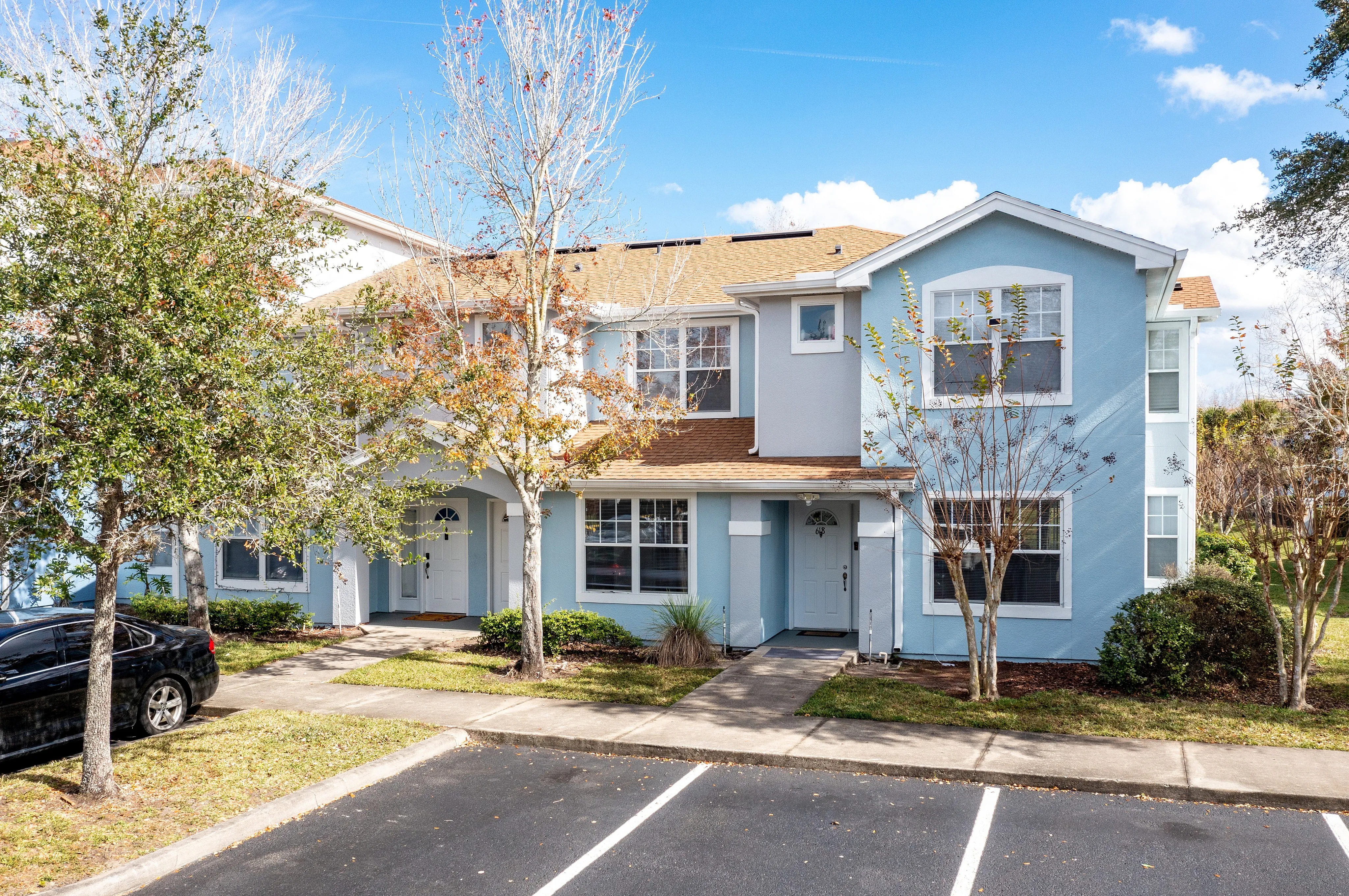 Charming townhome-style entrances with convenient parking.