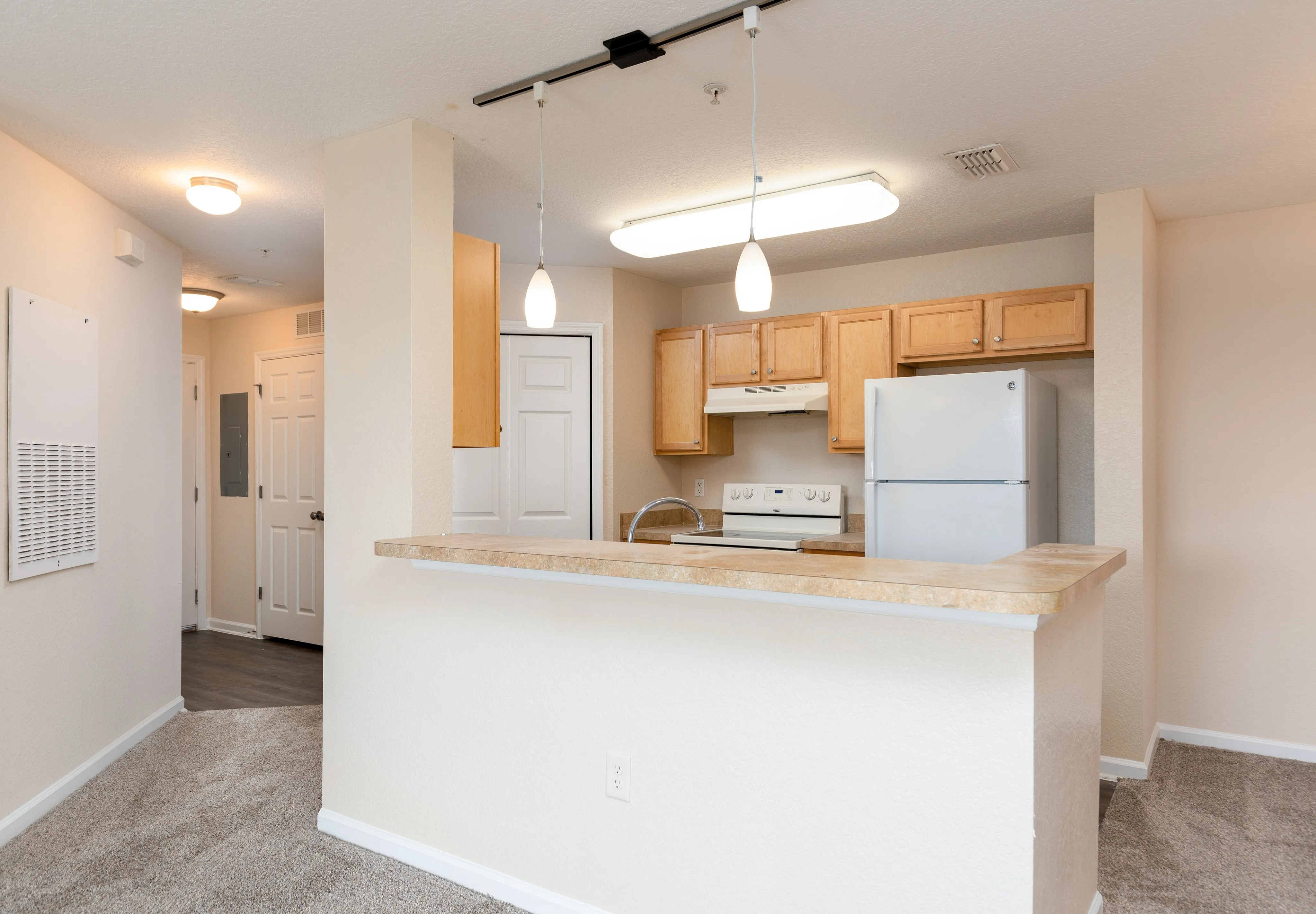 Open-concept kitchen with breakfast bar.