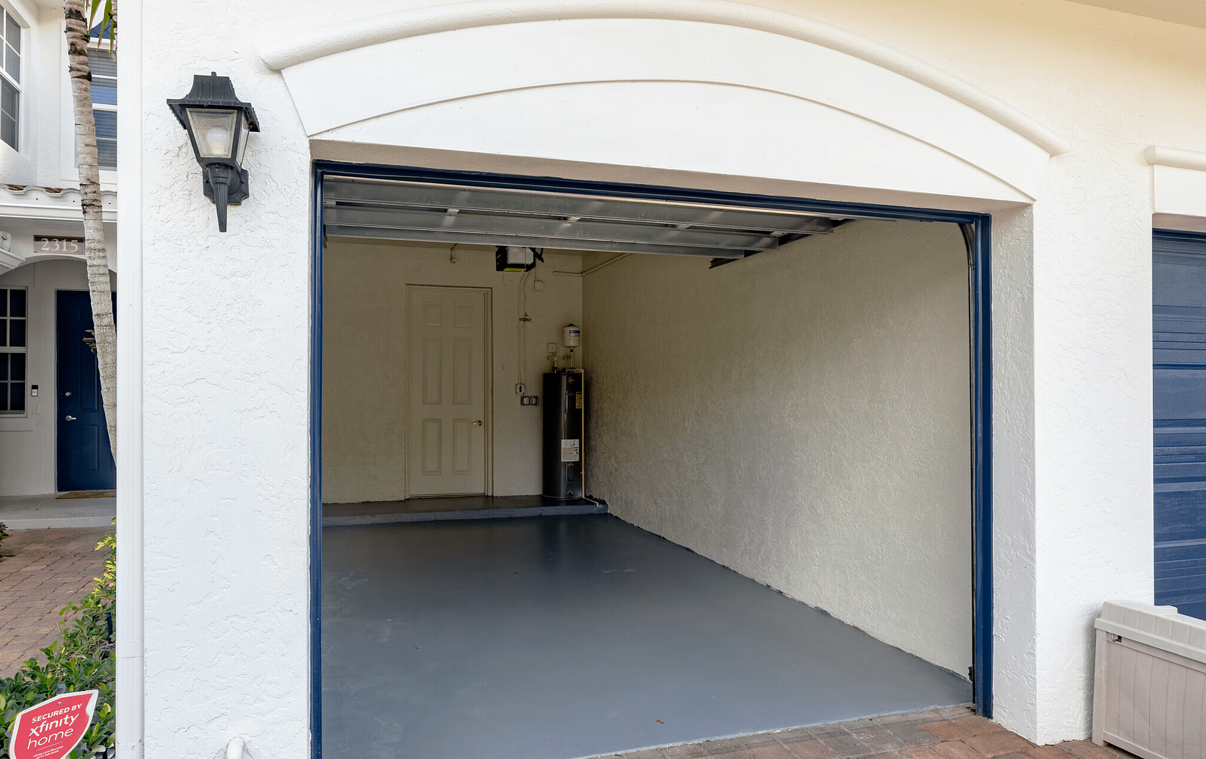 Spacious and secure garage with stylish exterior, ideal for car parking and additional storage space.