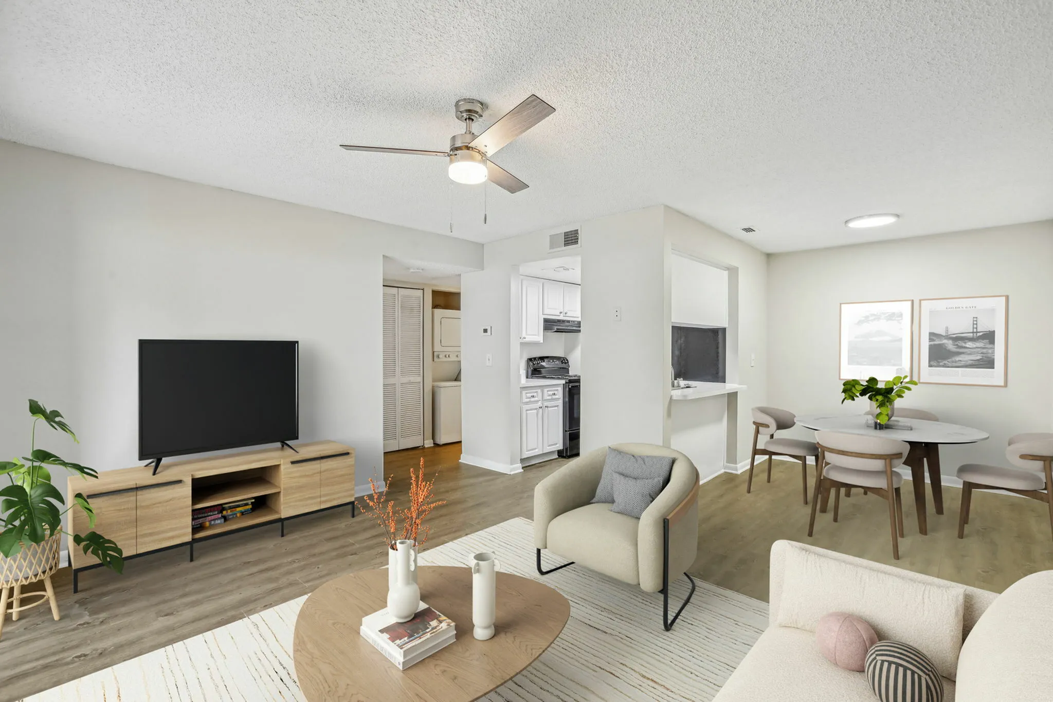 Aria Executive model rendering white walls oak planking moder furniture with area rug including dining area living area with galley kitchen in background