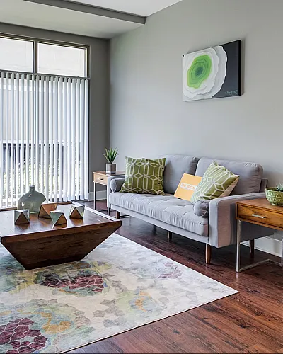 Bright and inviting living room with modern decor, large windows, and stylish furniture creating a welcoming atmosphere.