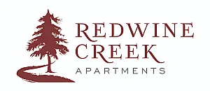 Elegant Redwine Creek Apartments logo featuring a stylized red tree and winding path, symbolizing natural beauty and serenity.