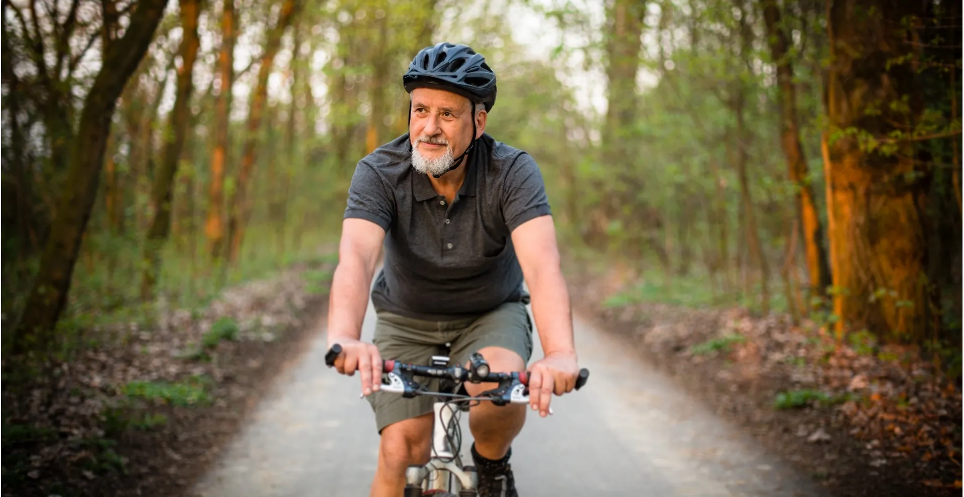 Man Riding Bike on Trail