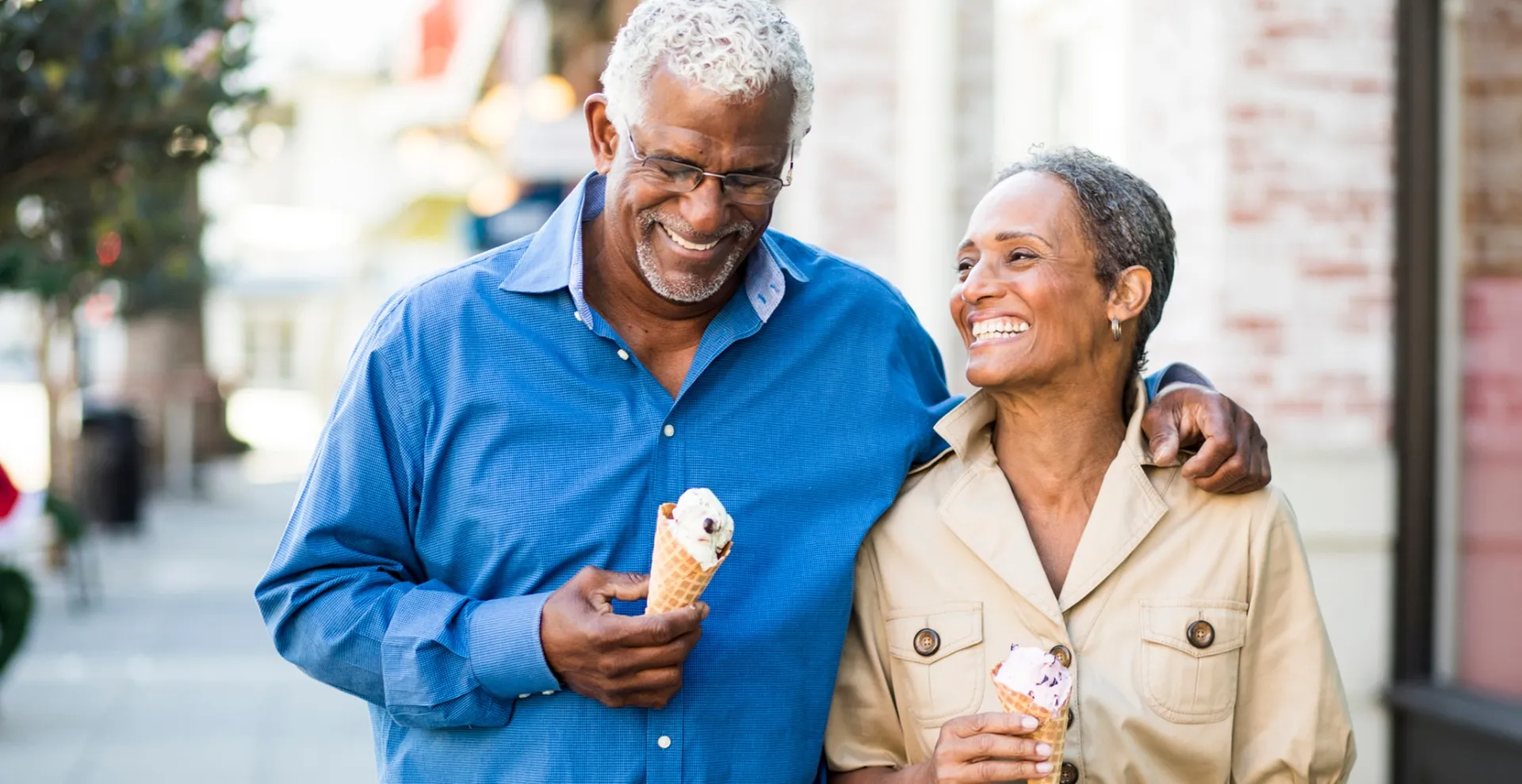 Couple walking and eating ice cream
