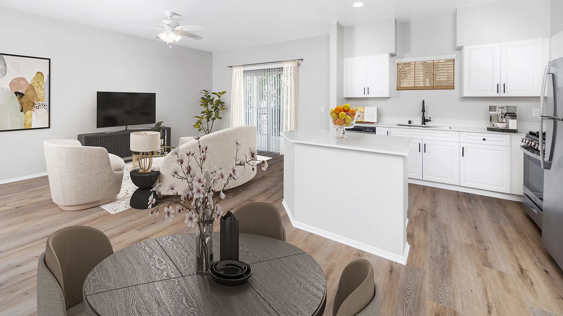 Model apartment with an open floor plan at Elate Rancho Cucamonga in Rancho Cucamonga, CA, featuring a view of the kitchen.