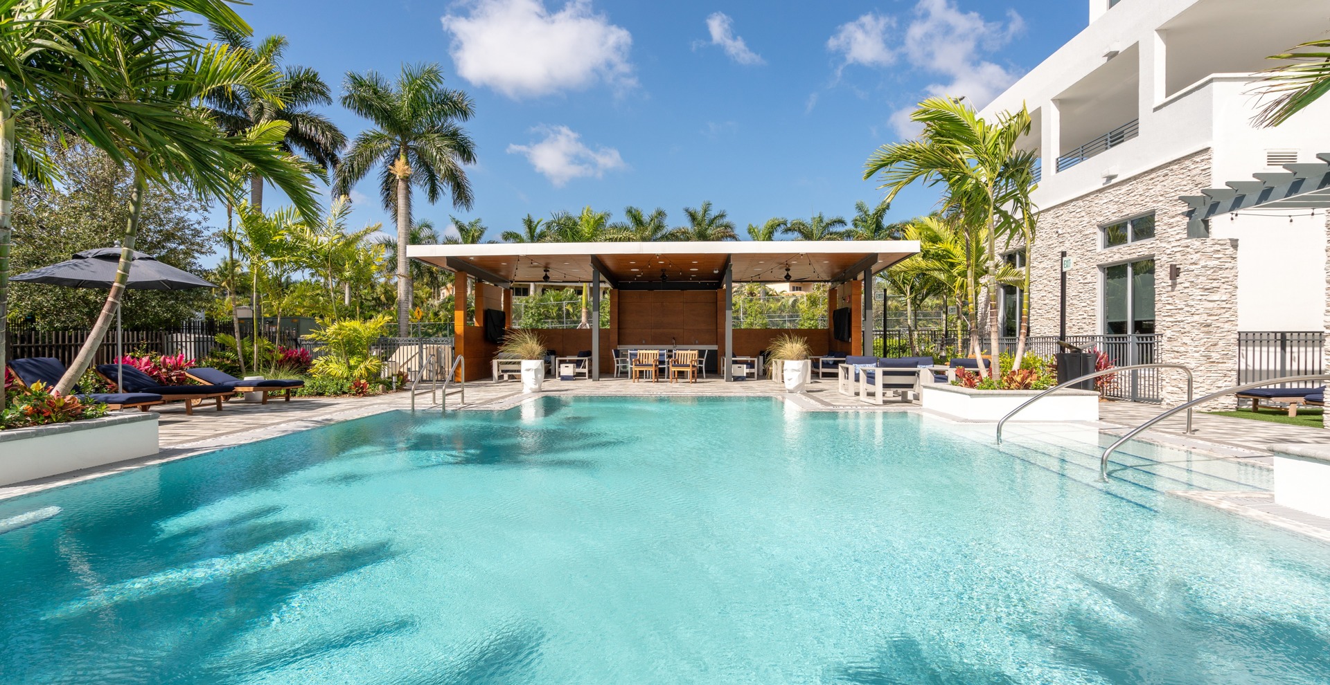 Sunny Pool with Palm Trees and Cabana