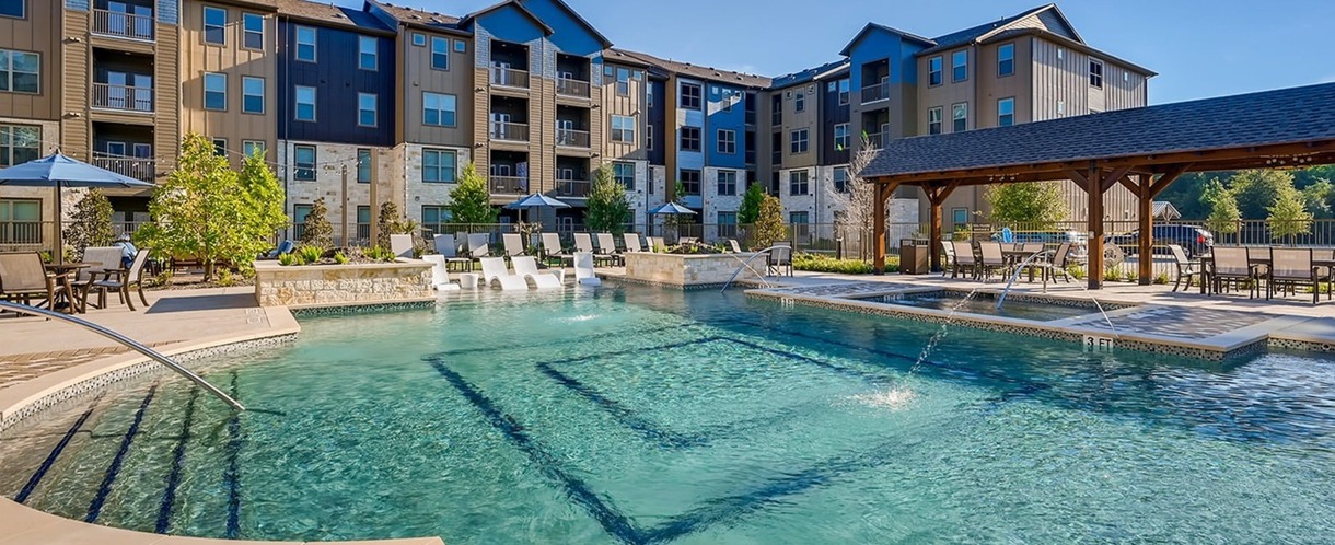 Alders Creek Crossing Building with pool view