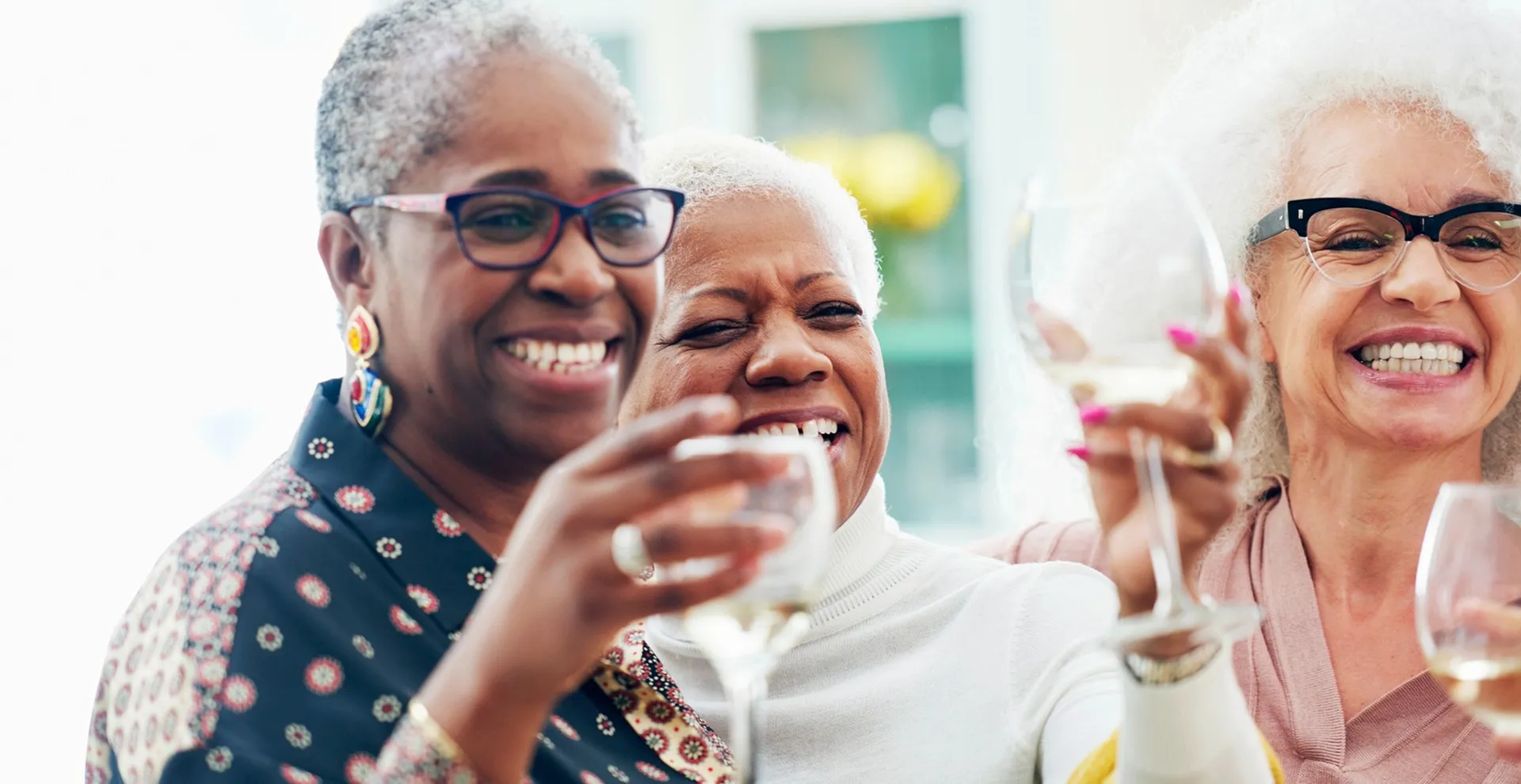 friends laughing and cheersing