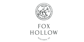 Elegant Fox Hollow logo in Malvern, PA featuring a sophisticated fox and bird emblem with initials.