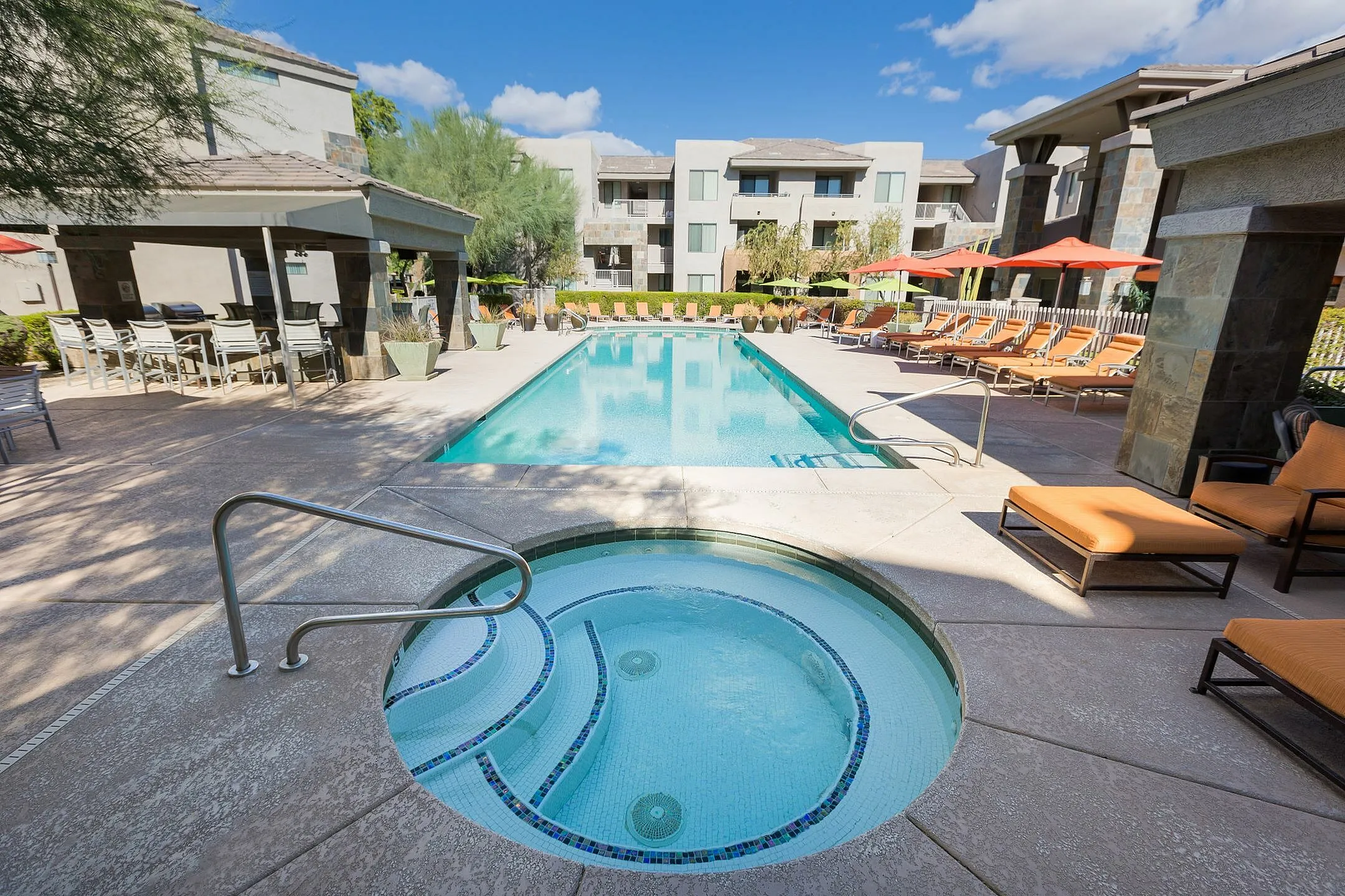 Pool and poolside area at Aria on Cave Creek Apartments.
